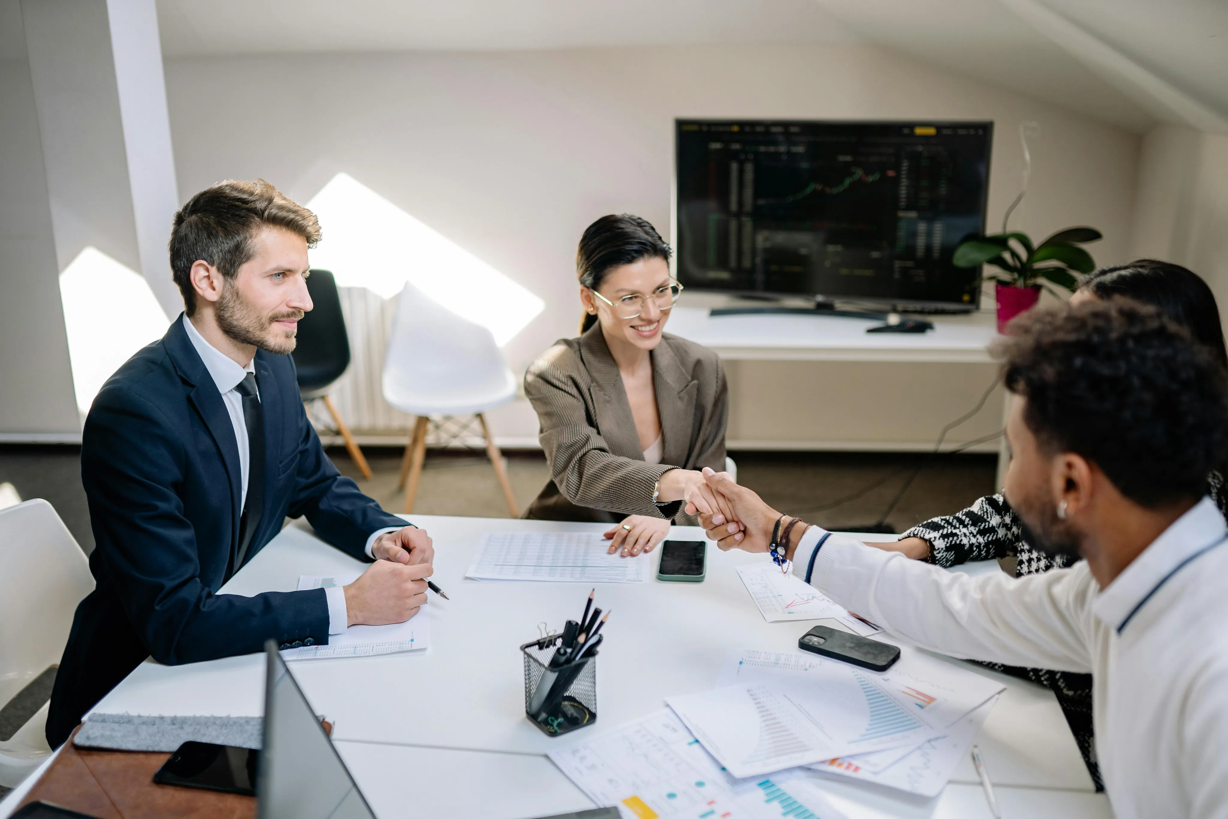 Financial advisory team collaborating in a modern office